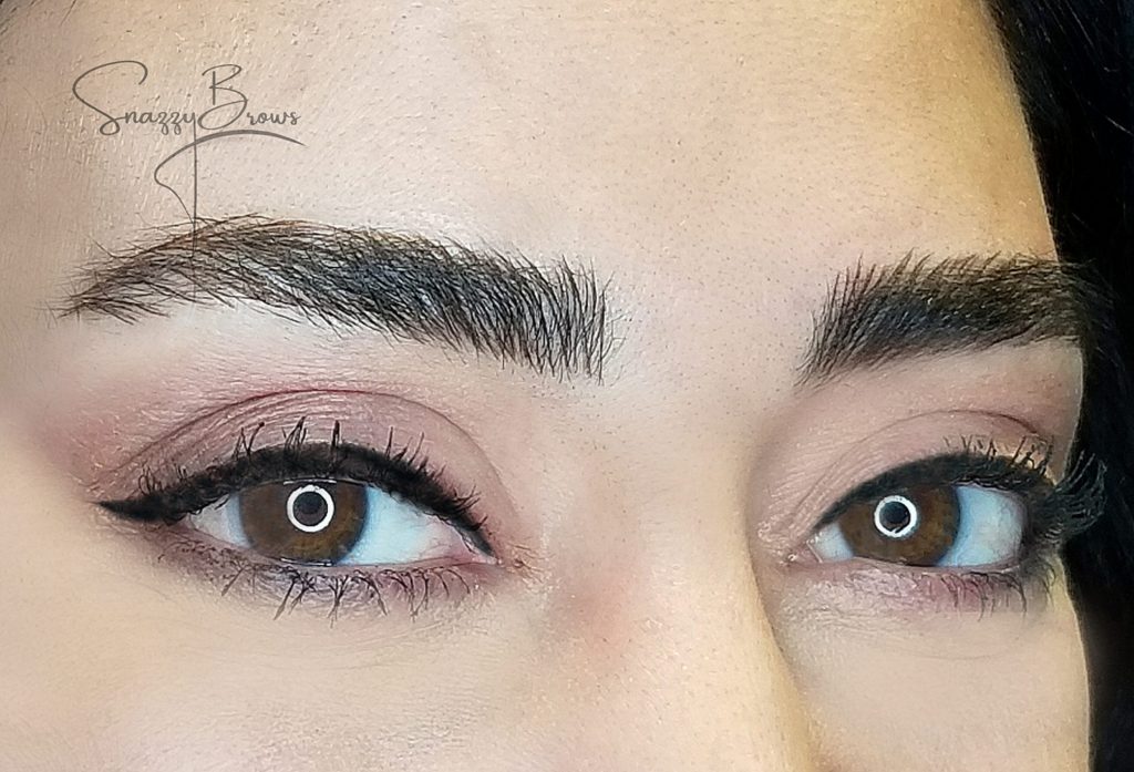 women's eyes with eyebrow microbladed looking at the camera